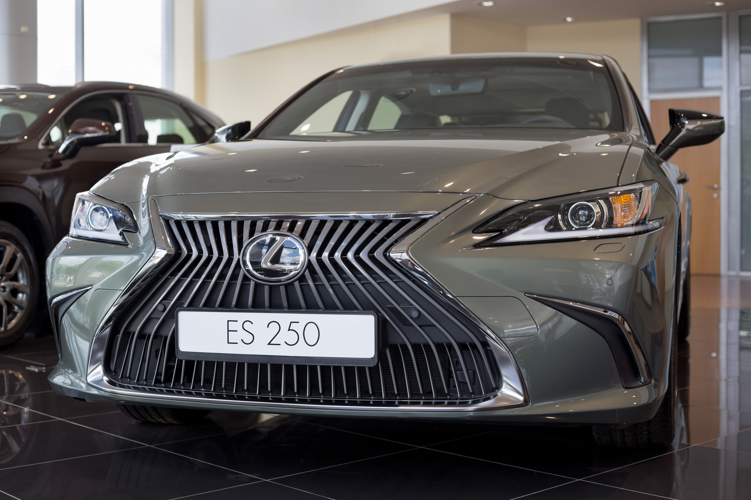Russia, Izhevsk - July 21, 2019: New modern car ES 250 in the Lexus showroom. Famous world brand. Prestigious vehicles.